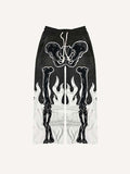 Pantalones con cintura elástica y estampado de calcomanías falsas de esqueleto y fuego en bloques de color 