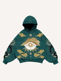 Sudadera con capucha y bolsillos inclinados con estampado gráfico de ojos, nubes, serpientes y palmeras 