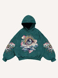 Sudadera con capucha y bolsillos inclinados con estampado gráfico de ojos, nubes y luna 