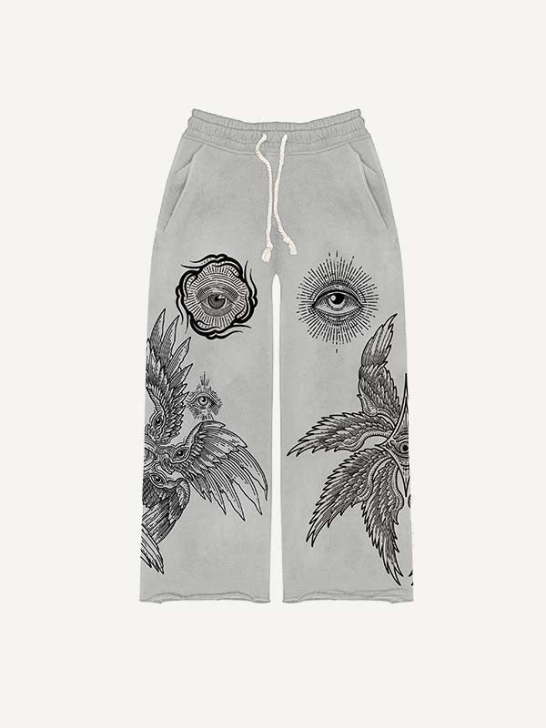 Pantalones con cintura elástica y estampado de ojos, alas y sol
