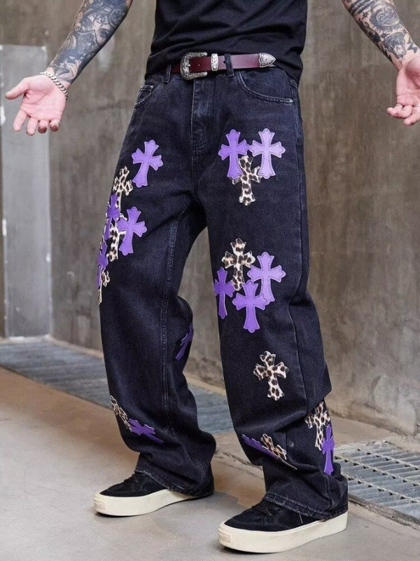 Vaqueros rectos con parches de cuero cruzado 