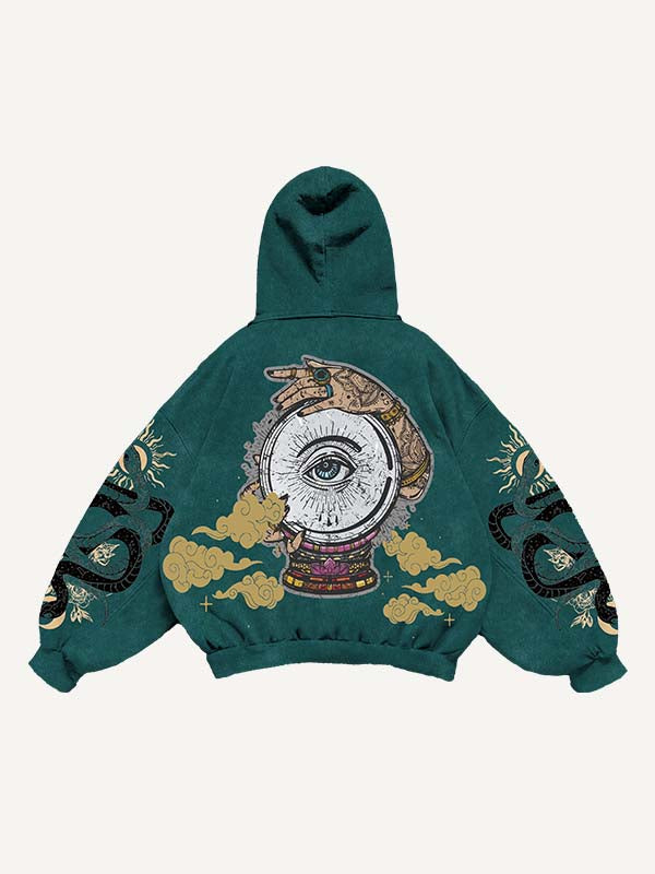 Sudadera con capucha y bolsillos inclinados con estampado gráfico de ojos, nubes, serpientes y palmeras 