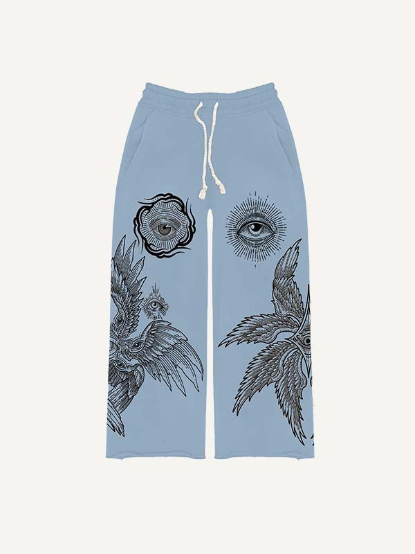 Pantalones con cintura elástica y estampado de ojos, alas y sol
