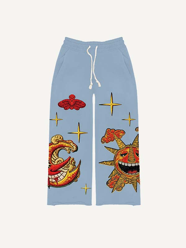 Pantalones con cintura elástica y estampado de calcomanías falsas de sol, luna, estrellas y nubes malvados 