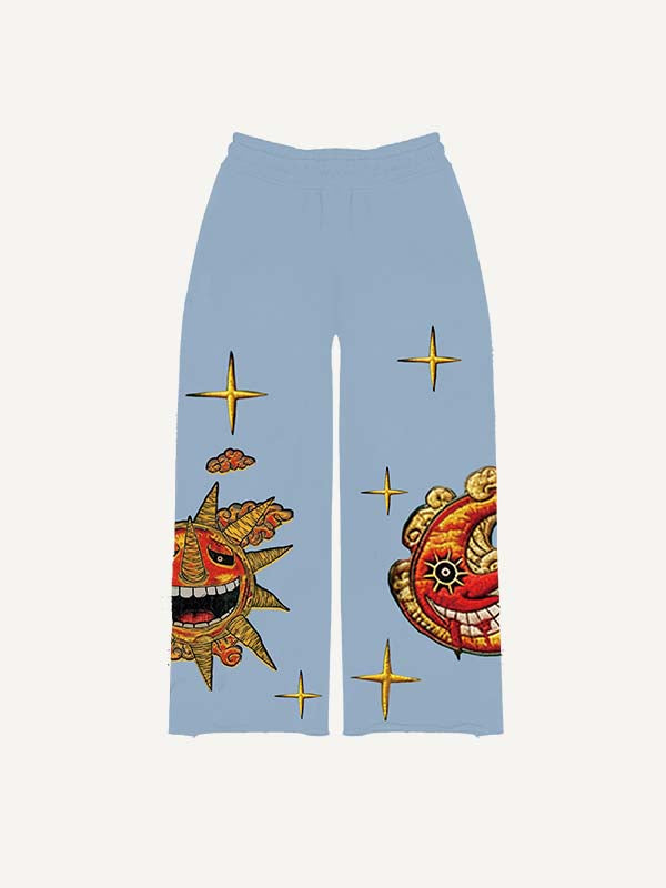 Pantalones con cintura elástica y estampado de calcomanías falsas de sol, luna, estrellas y nubes malvados 