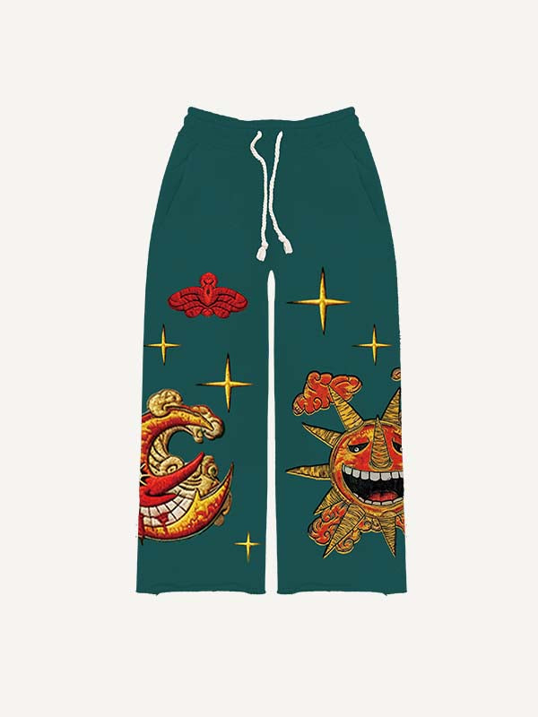 Pantalones con cintura elástica y estampado de calcomanías falsas de sol, luna, estrellas y nubes malvados 