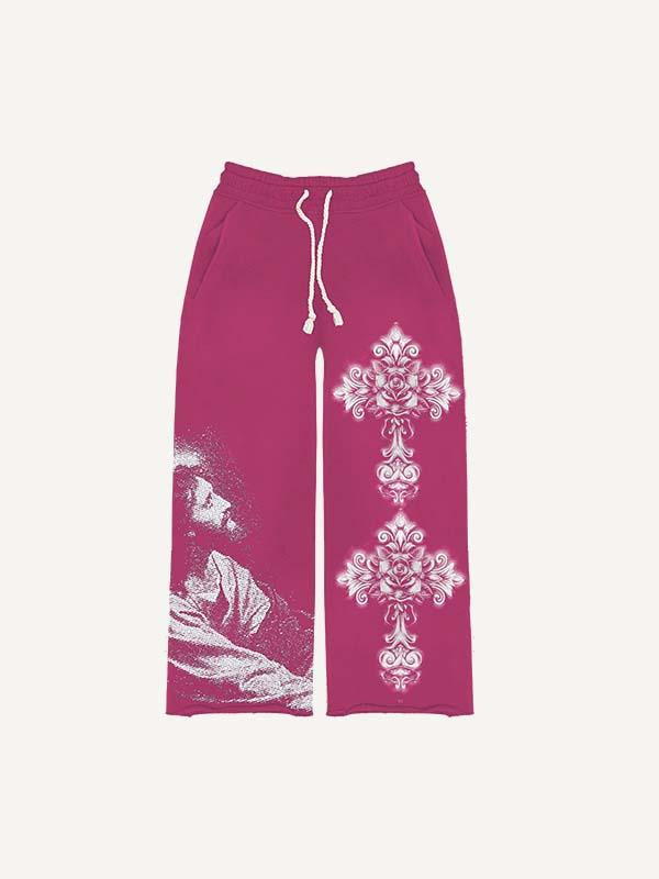 Pantalones con cintura elástica y estampado floral y de figuras cruzadas 